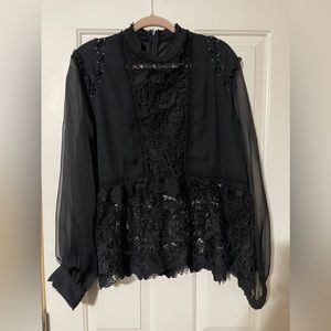 Black feminine, lacy and sexy blouse (2X tag with an XL fit.)